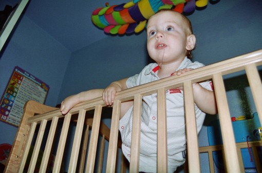 David climbing out of the crib