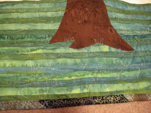 Tuffs of Grass quilted on the Tree Art Quilt - 9-09